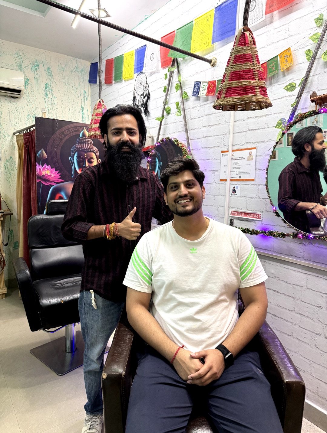 Gurnam Bhullar seated in the styling chair with Shubham at NS Unisex Hair Studio 1929